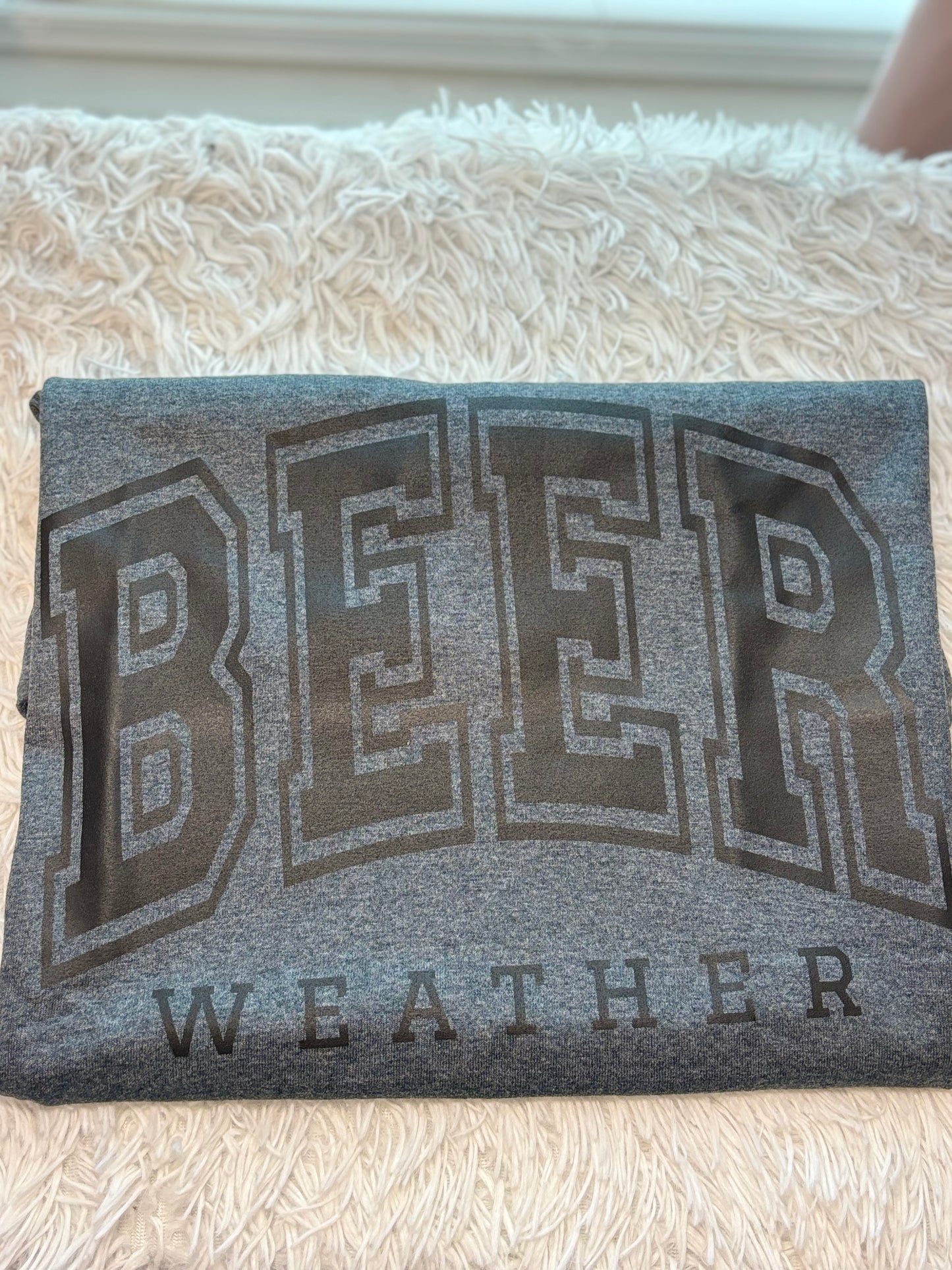 Dark heather heat press t-shirt with 'BEER WEATHER' text in black