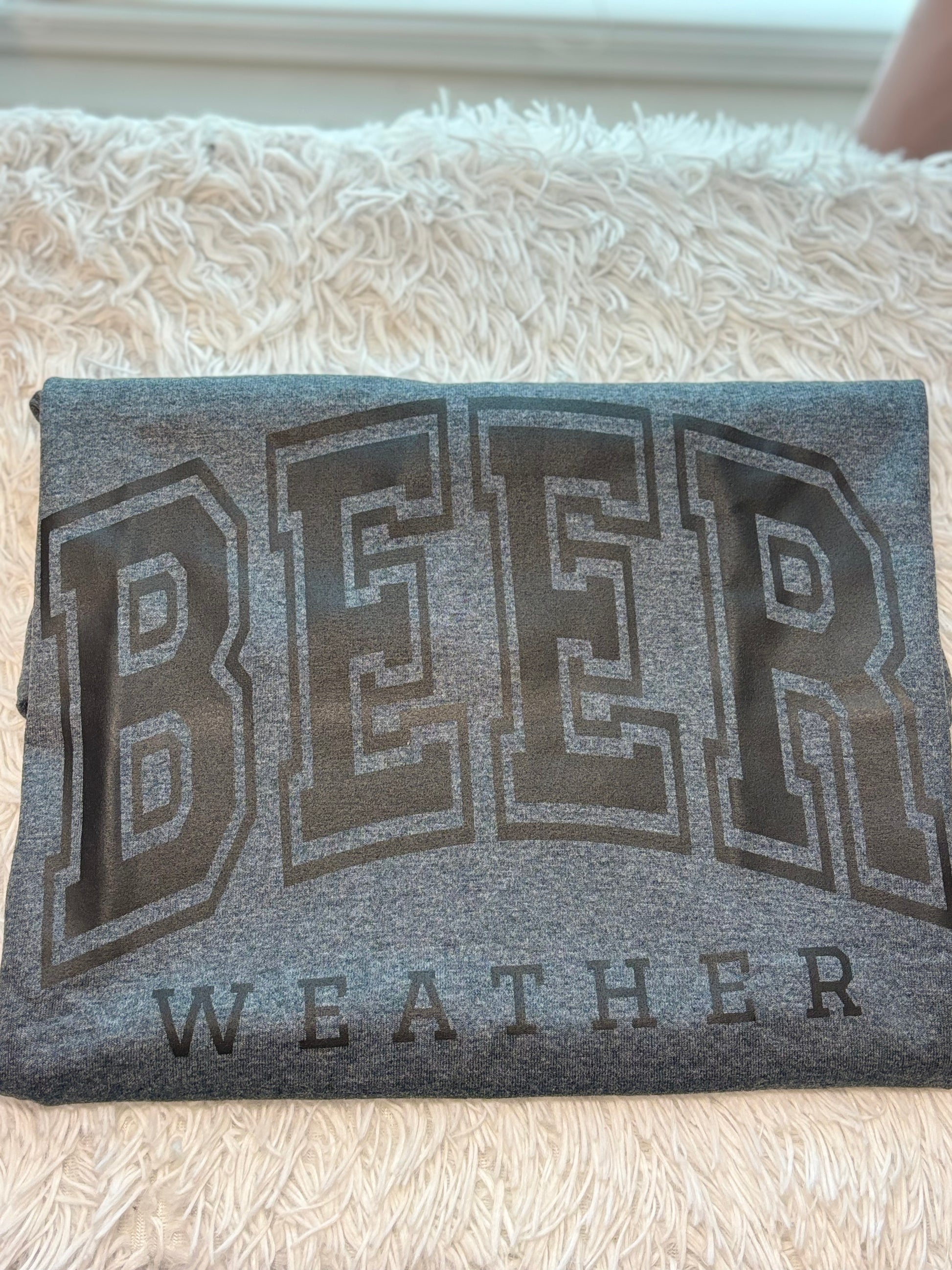 Dark heather heat press t-shirt with 'BEER WEATHER' text in black