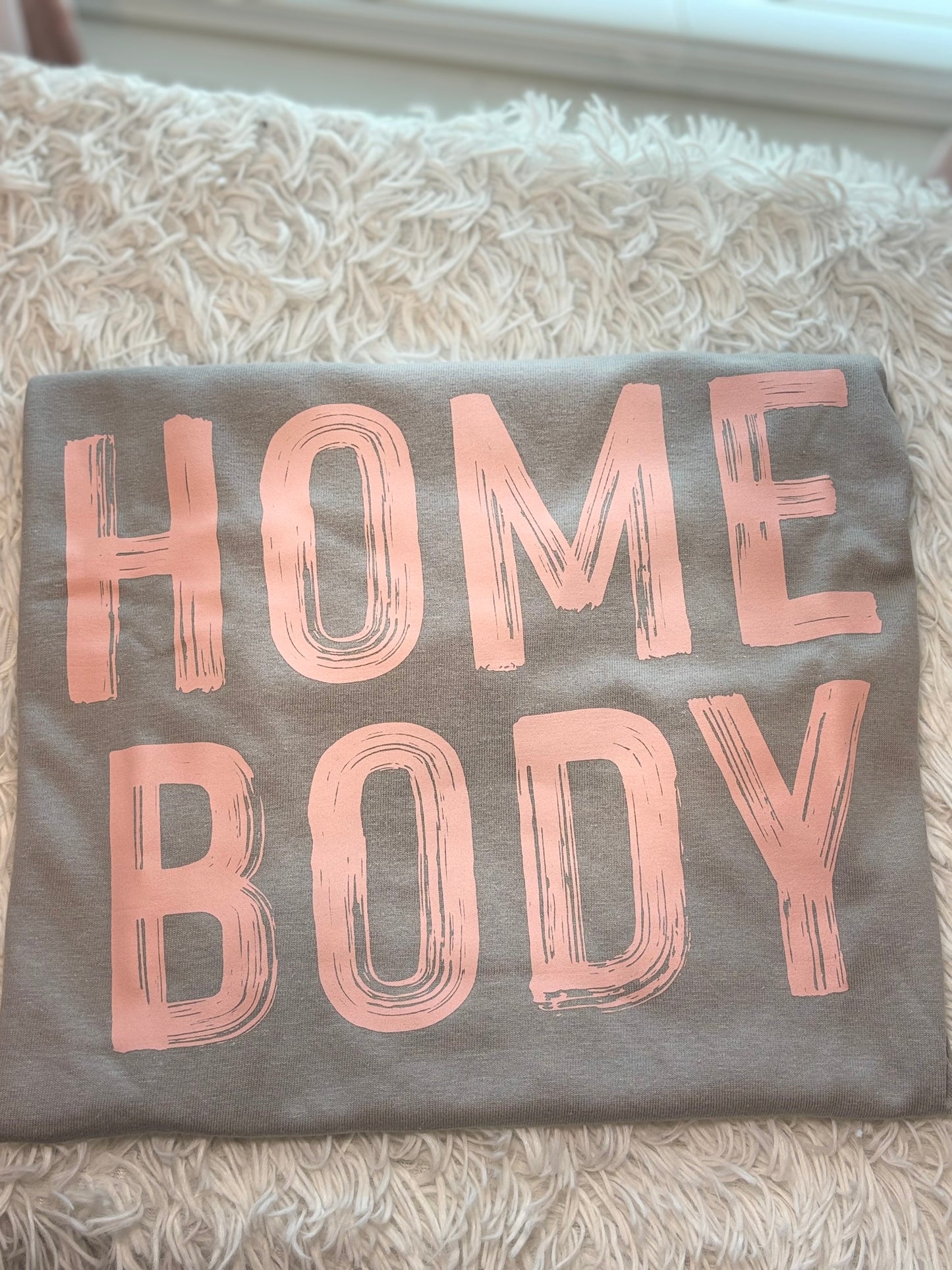 Gray heat press t-shirt with 'HOME BODY' text in pink