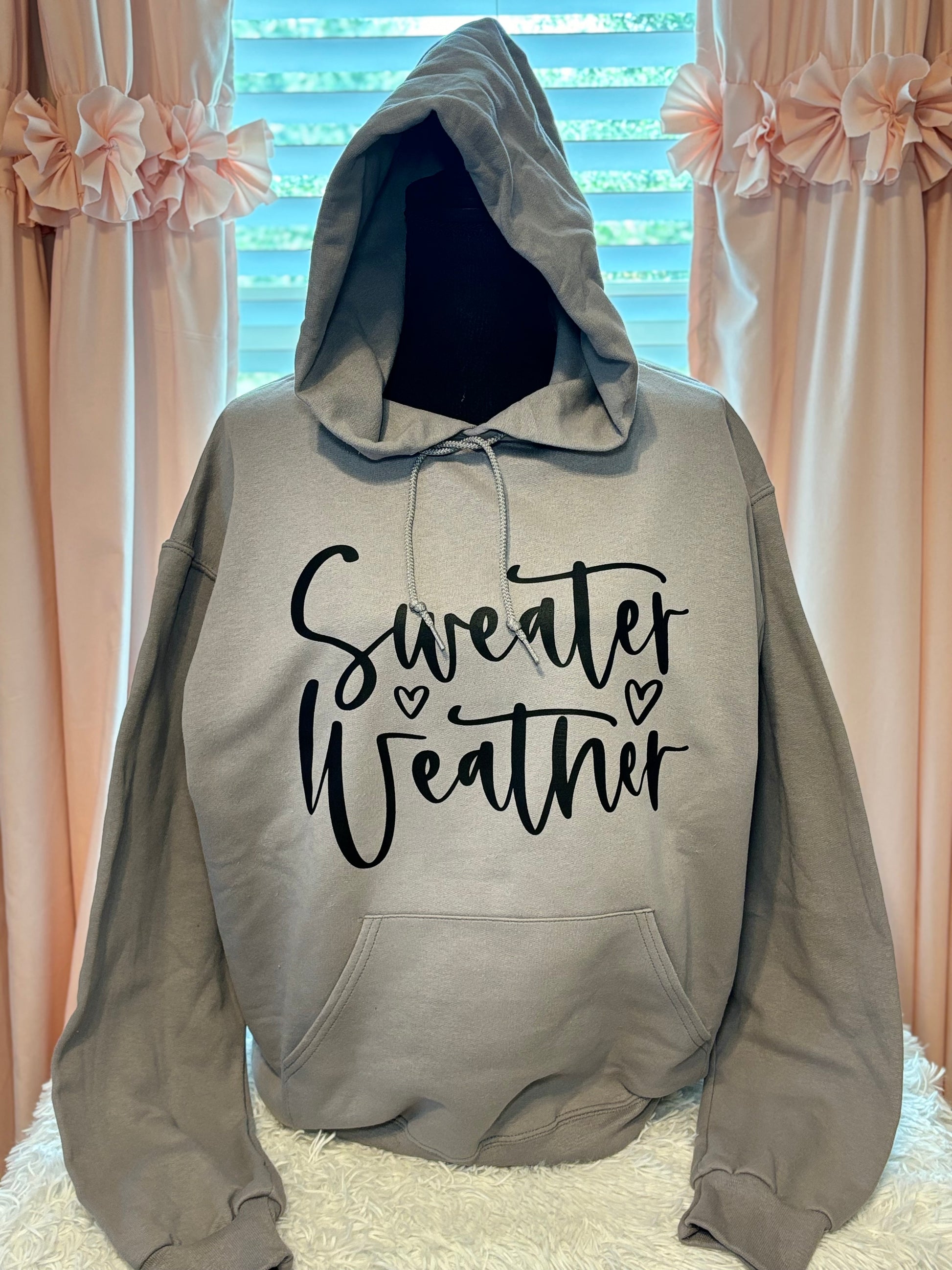 Gray heat press hoodie with 'Sweater Weather' text in black
