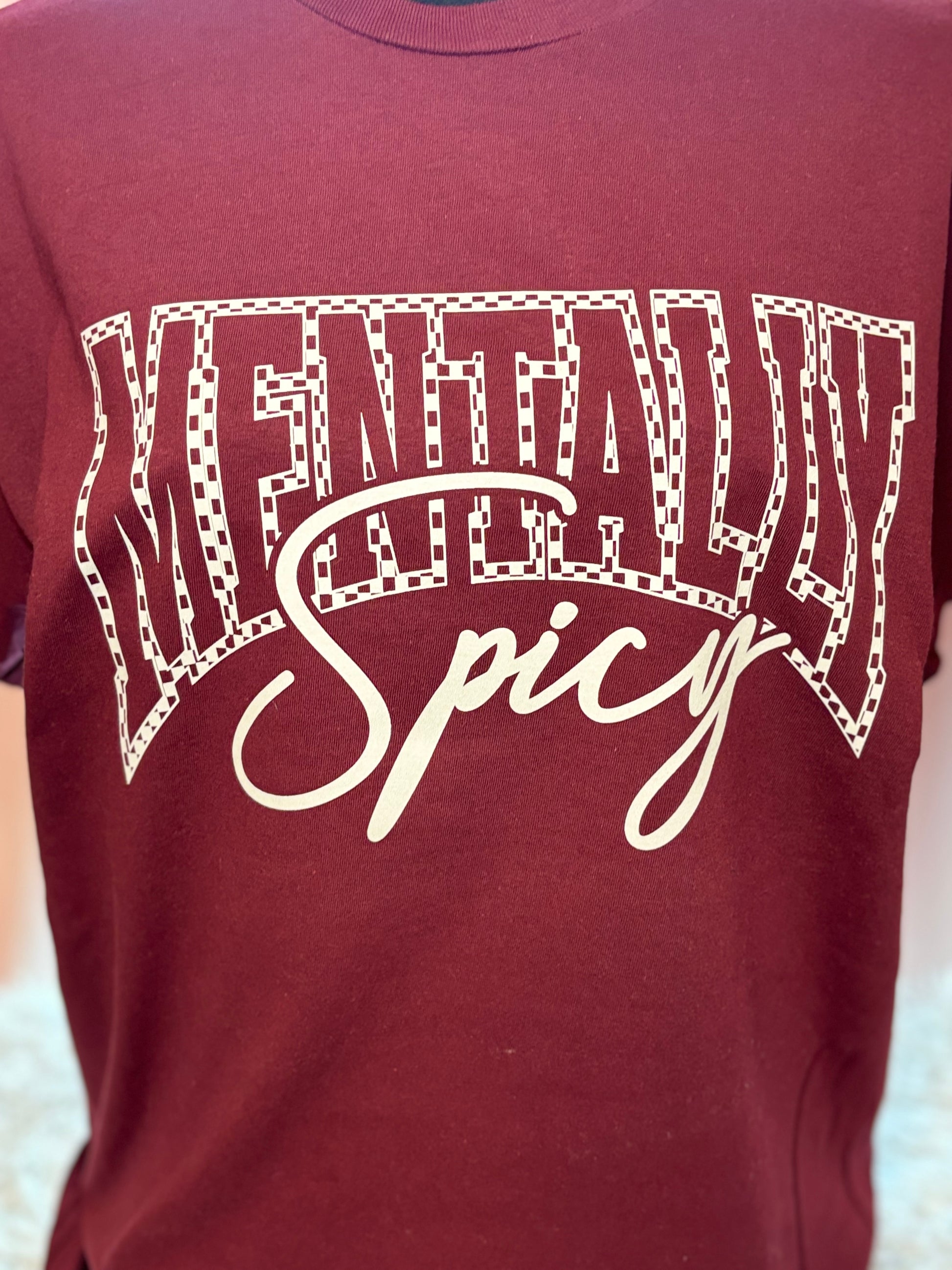 Maroon heat press t-shirt with 'Mentally Spicy' text in white- checkered outline
