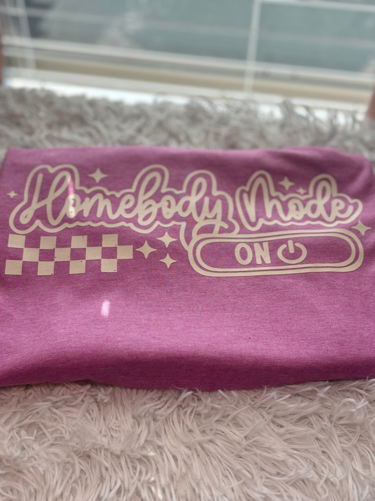 Heather Orchid heat press t-shirt with 'Homebody Mode ON' text in beige