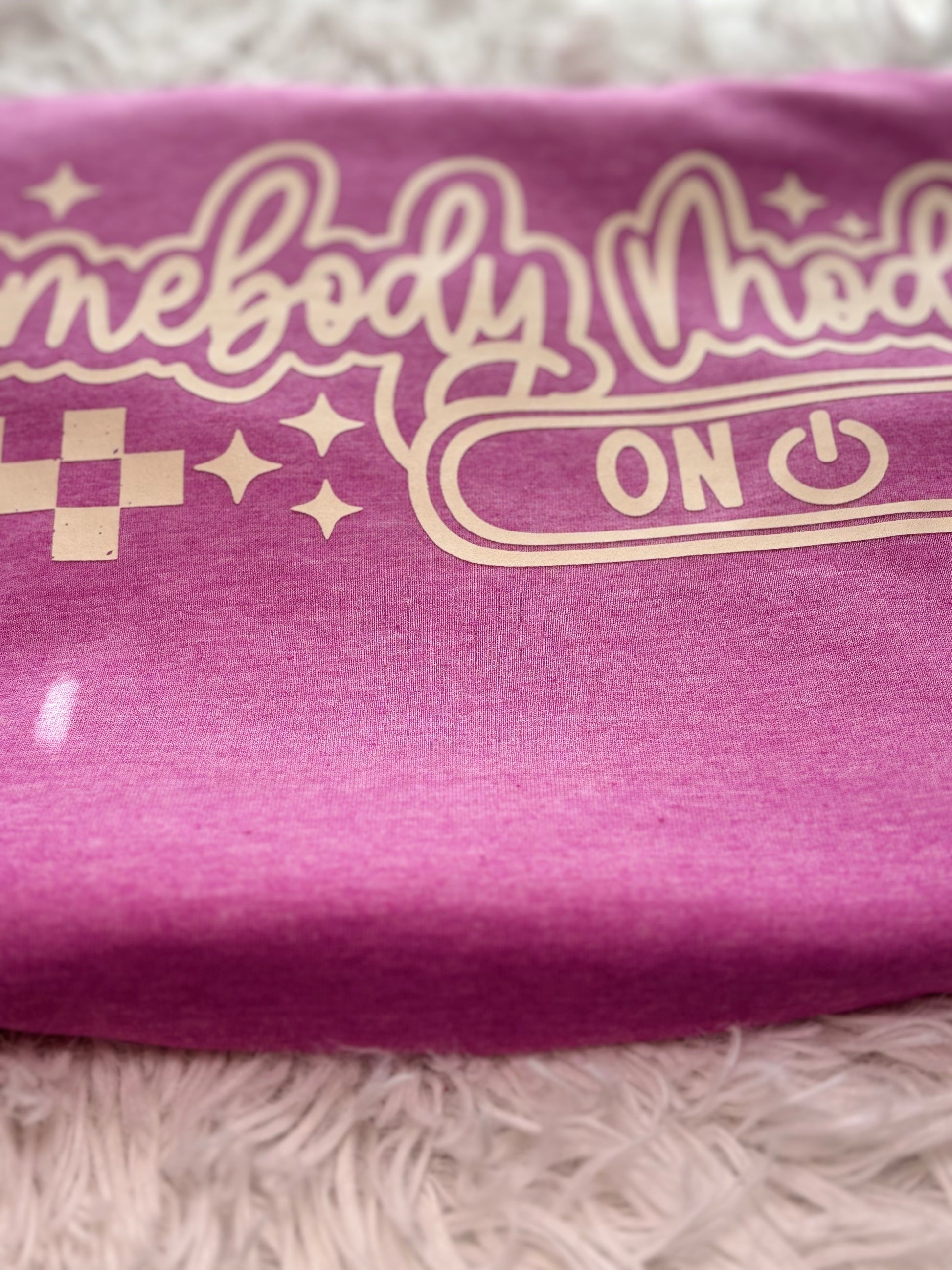 Heather Orchid heat press t-shirt with 'Homebody Mode ON' text in beige