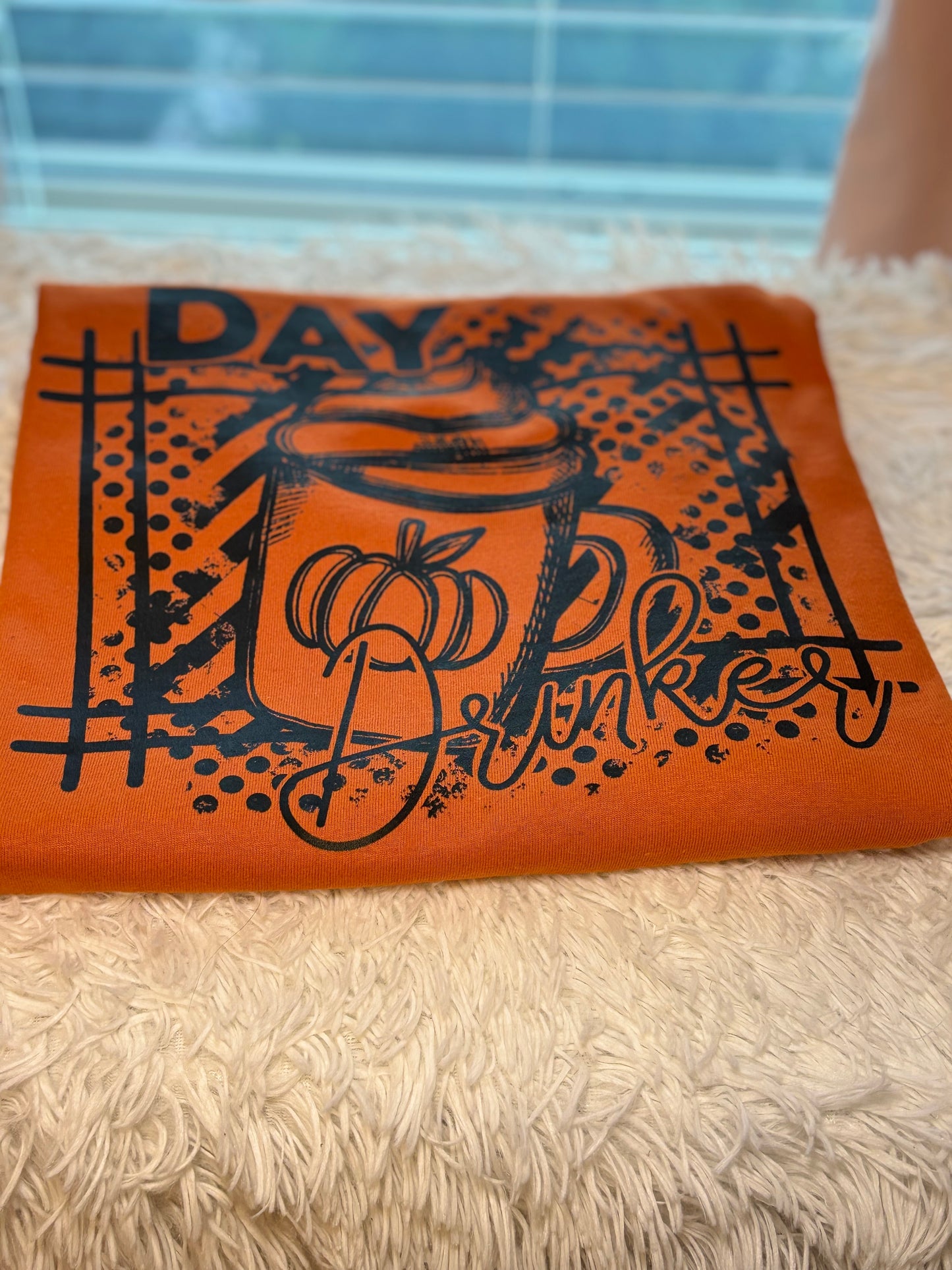 Orange long sleeve t-shirt with black graphic heat press design- Day Drinker latte