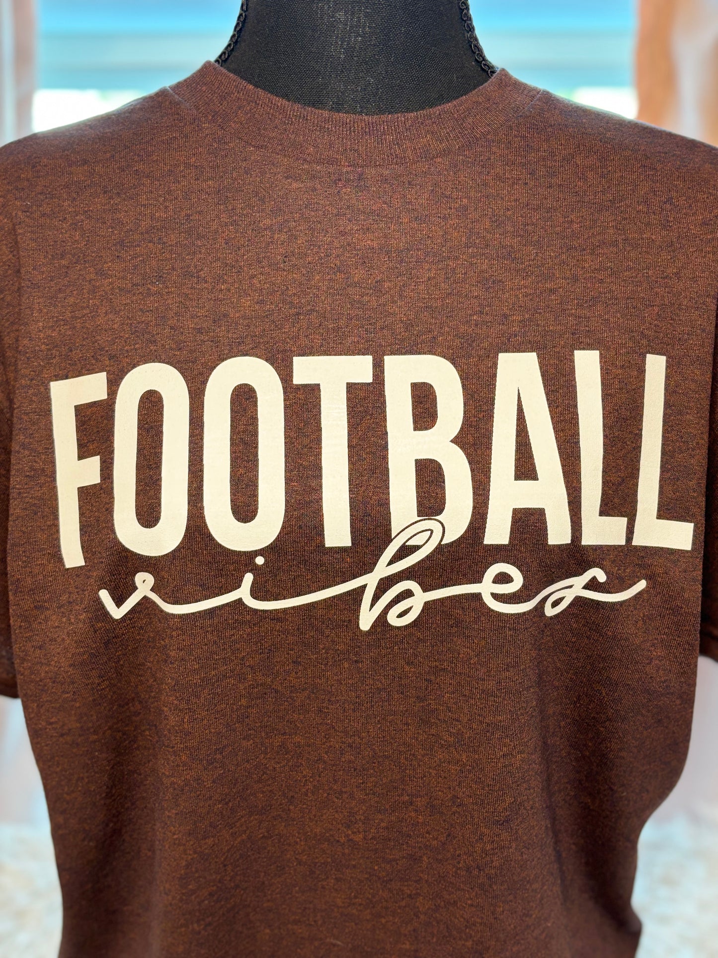Brown heat press t-shirt with 'FOOTBALL vibes' text in white