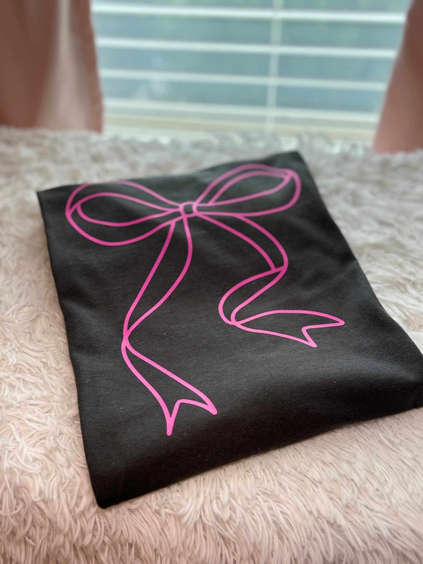 Charcoal heat press t-shirt with a pink bow design 