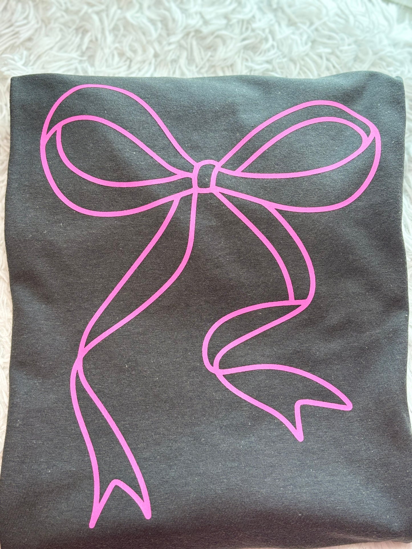 Charcoal heat press t-shirt with a pink bow design 