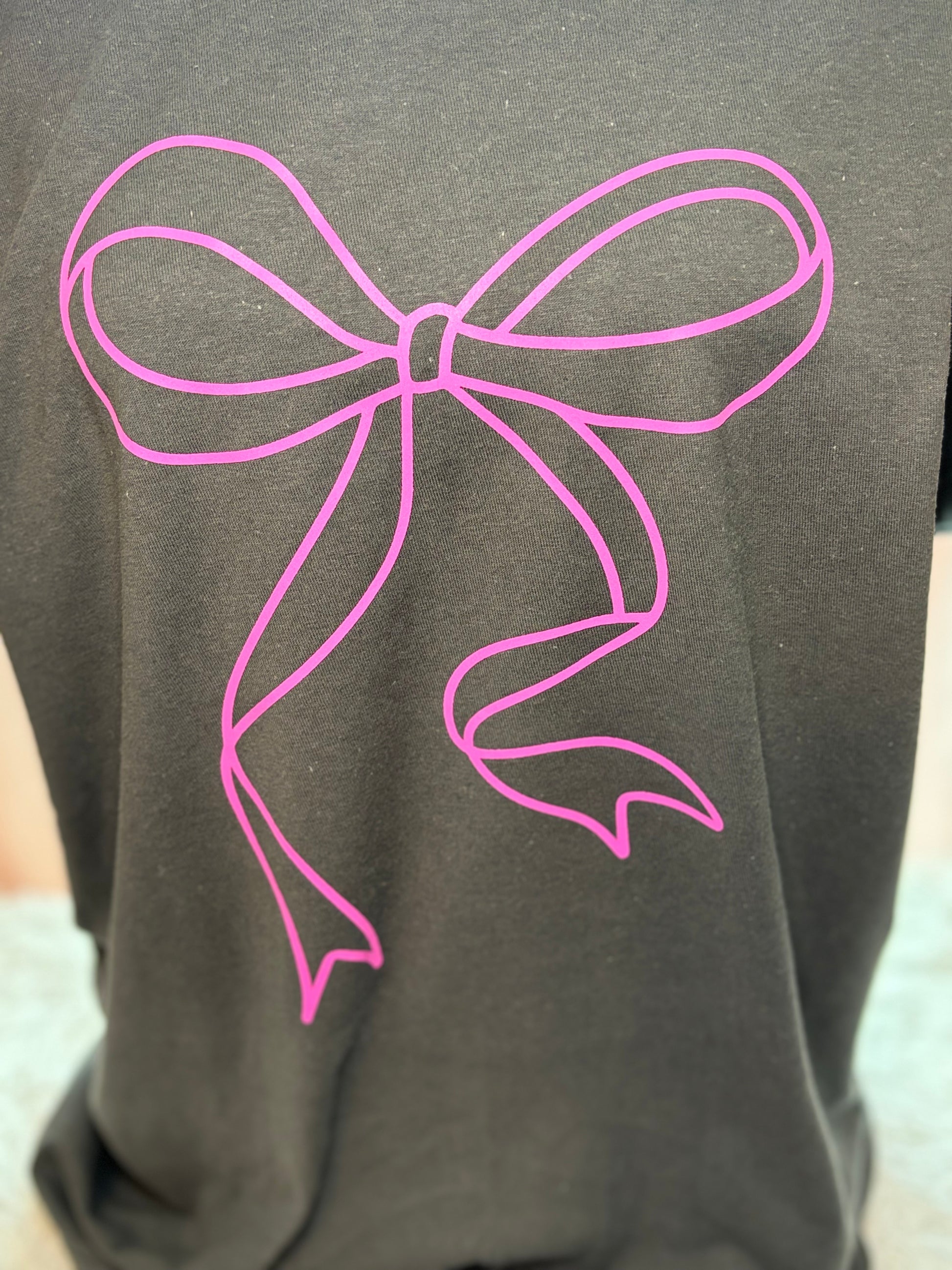 Charcoal heat press t-shirt with a pink bow design 