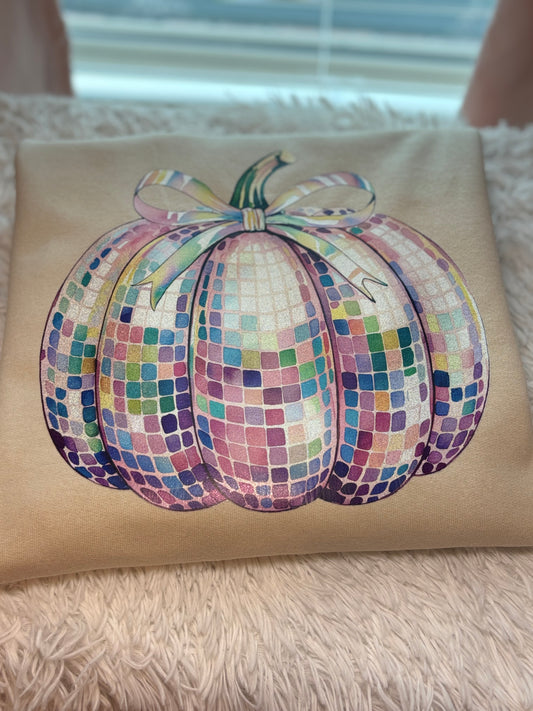 Heat pressed beige sweatshirt with a glitter disco pumpkin design