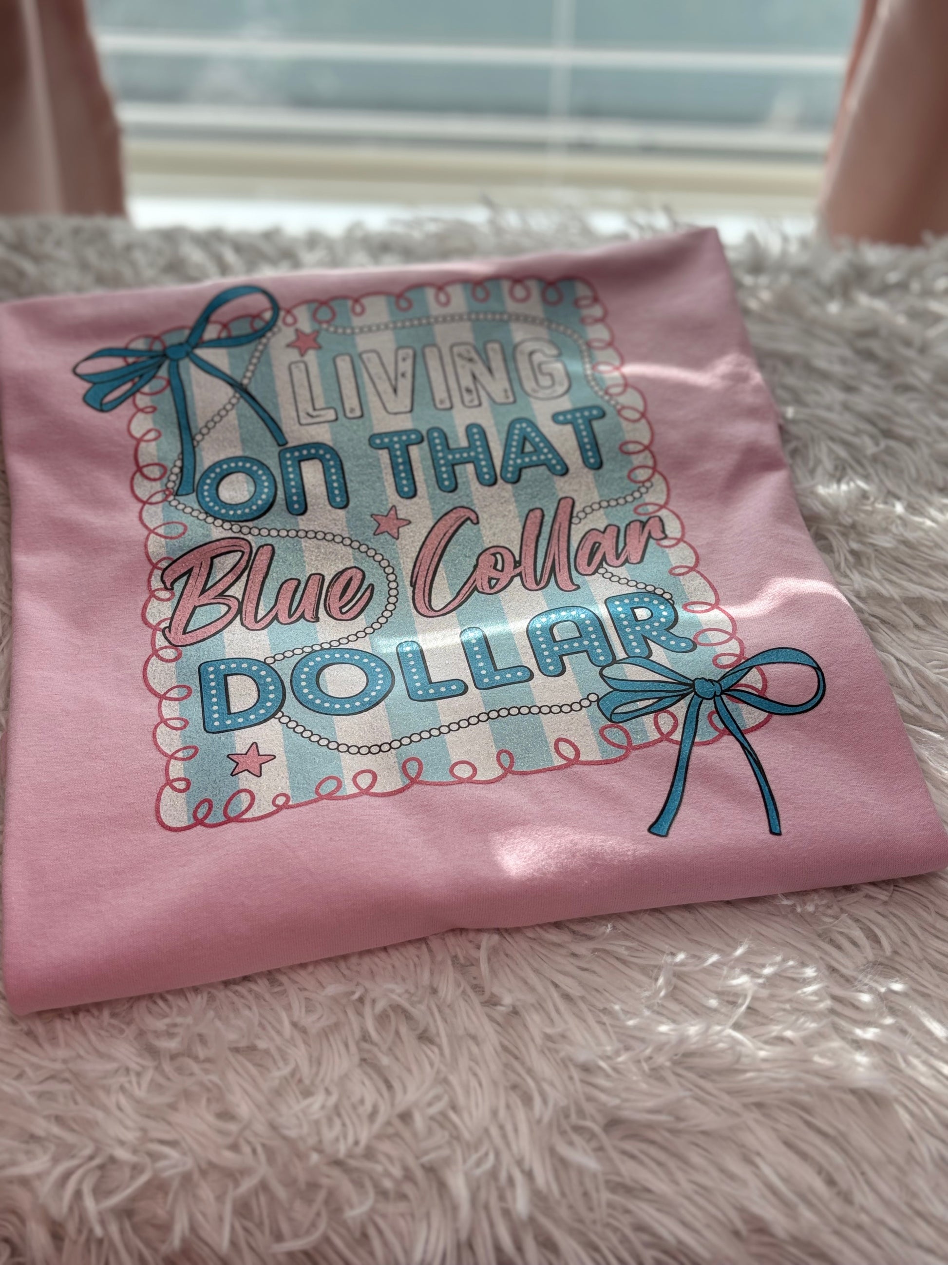 Pink heat press t-shirt with "Living on that Blue Collar Dollar" text and decorative elements