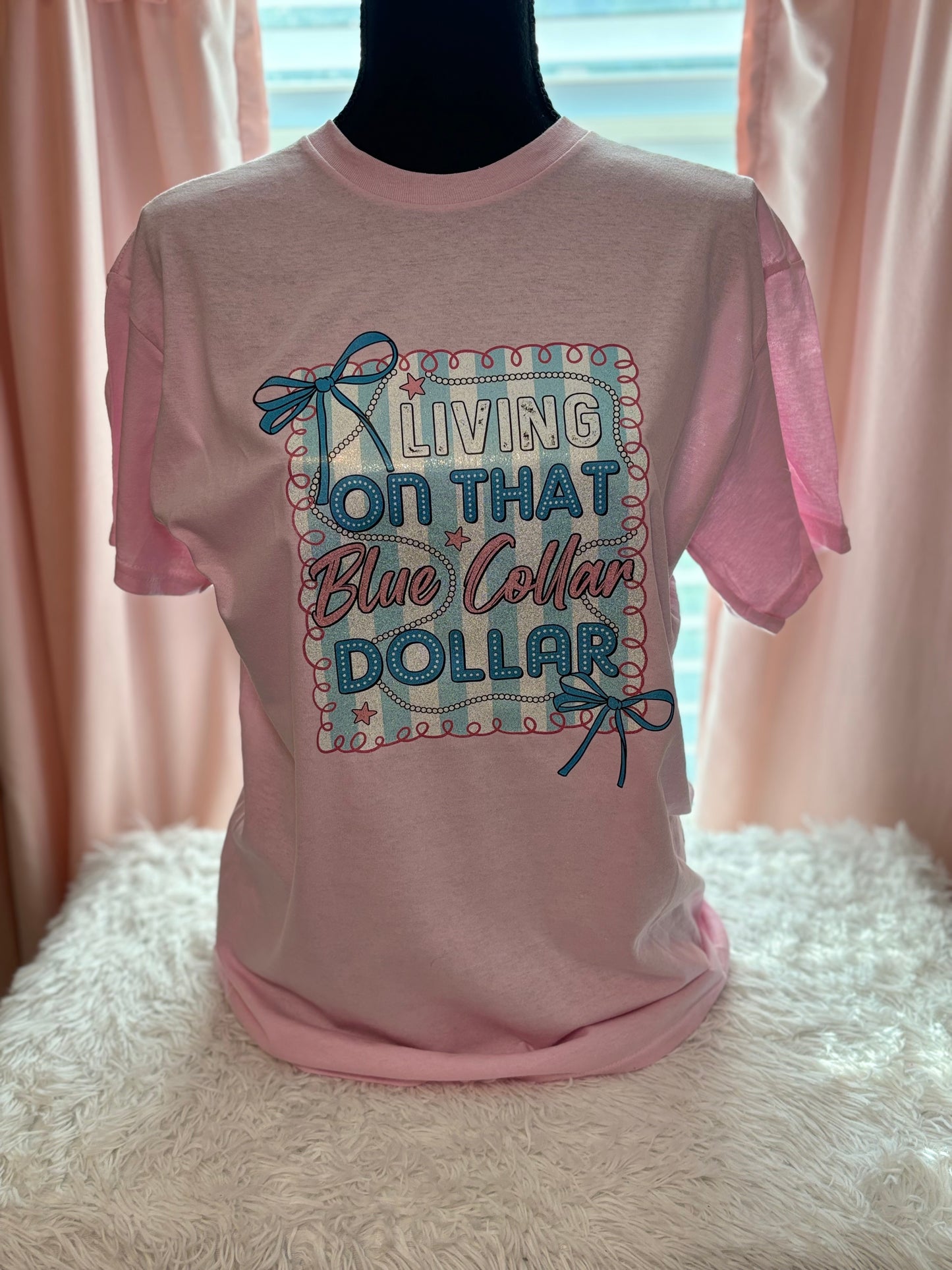 Pink heat press t-shirt with "Living on that Blue Collar Dollar" text and decorative elements