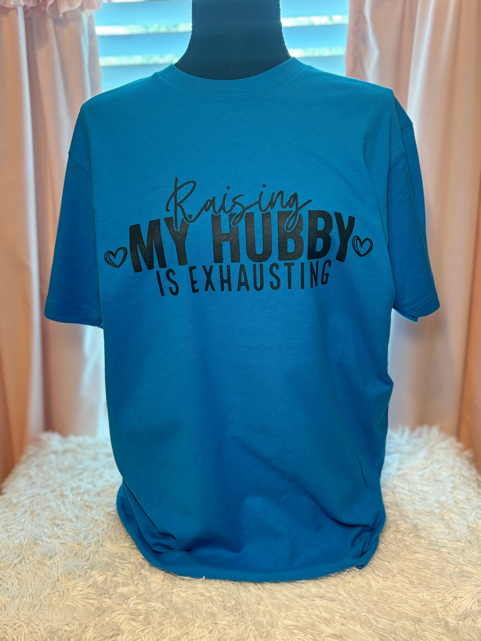 Turquoise heat press t-shirt with text 'Raising MY HUBBY IS EXHAUSTING' in black