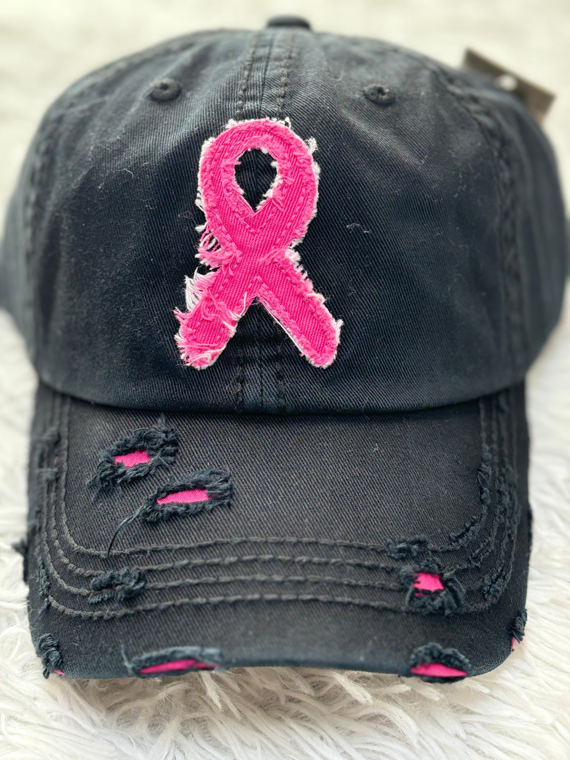 Black distressed baseball cap with a pink breast cancer awareness ribbon 