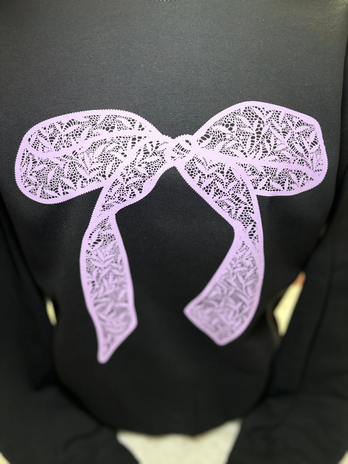 Black heat press sweatshirt with a purple lace bow design 