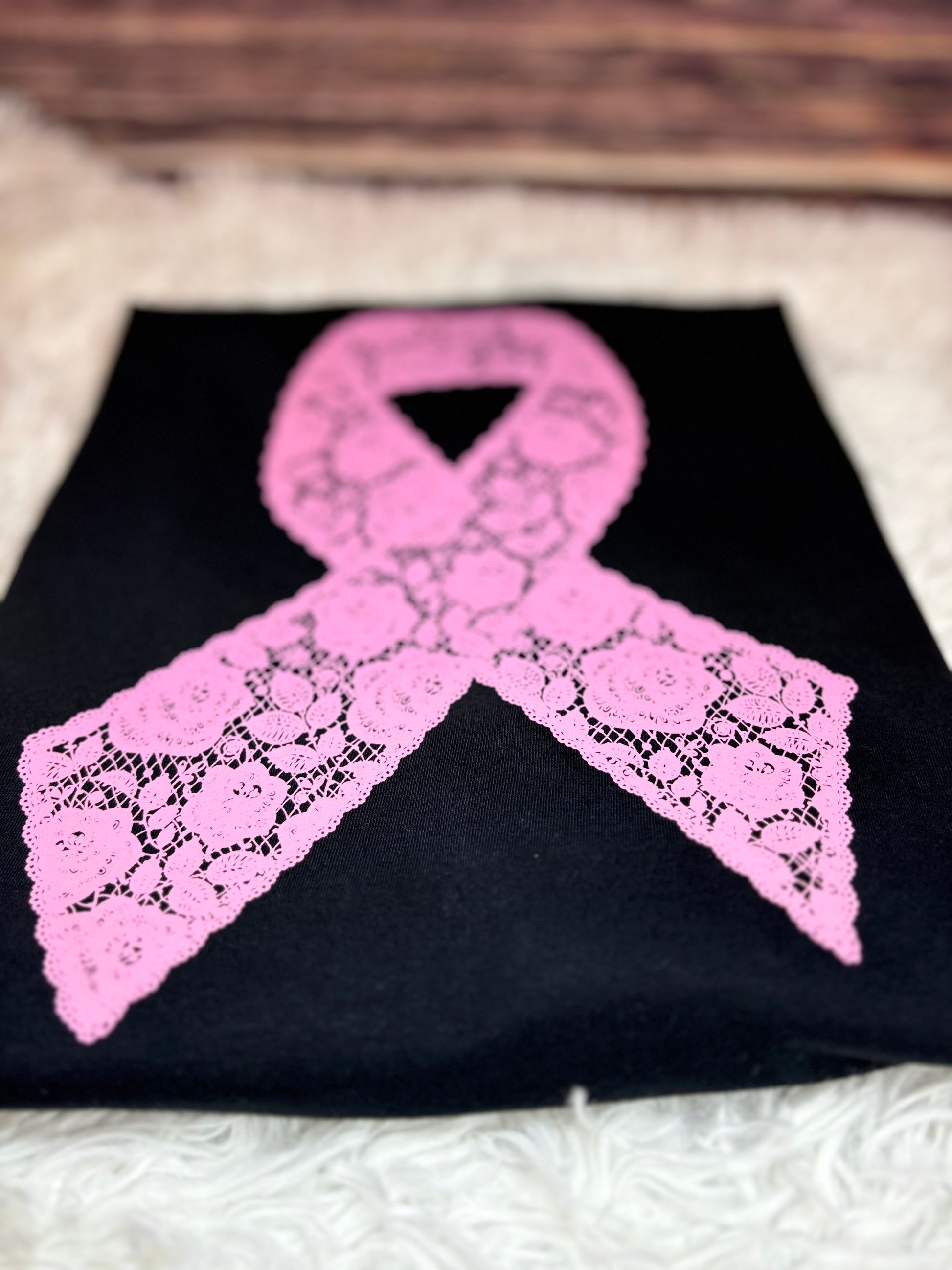 Black heat pressed t-shirt with a pink lace floral ribbon design- breast cancer awareness