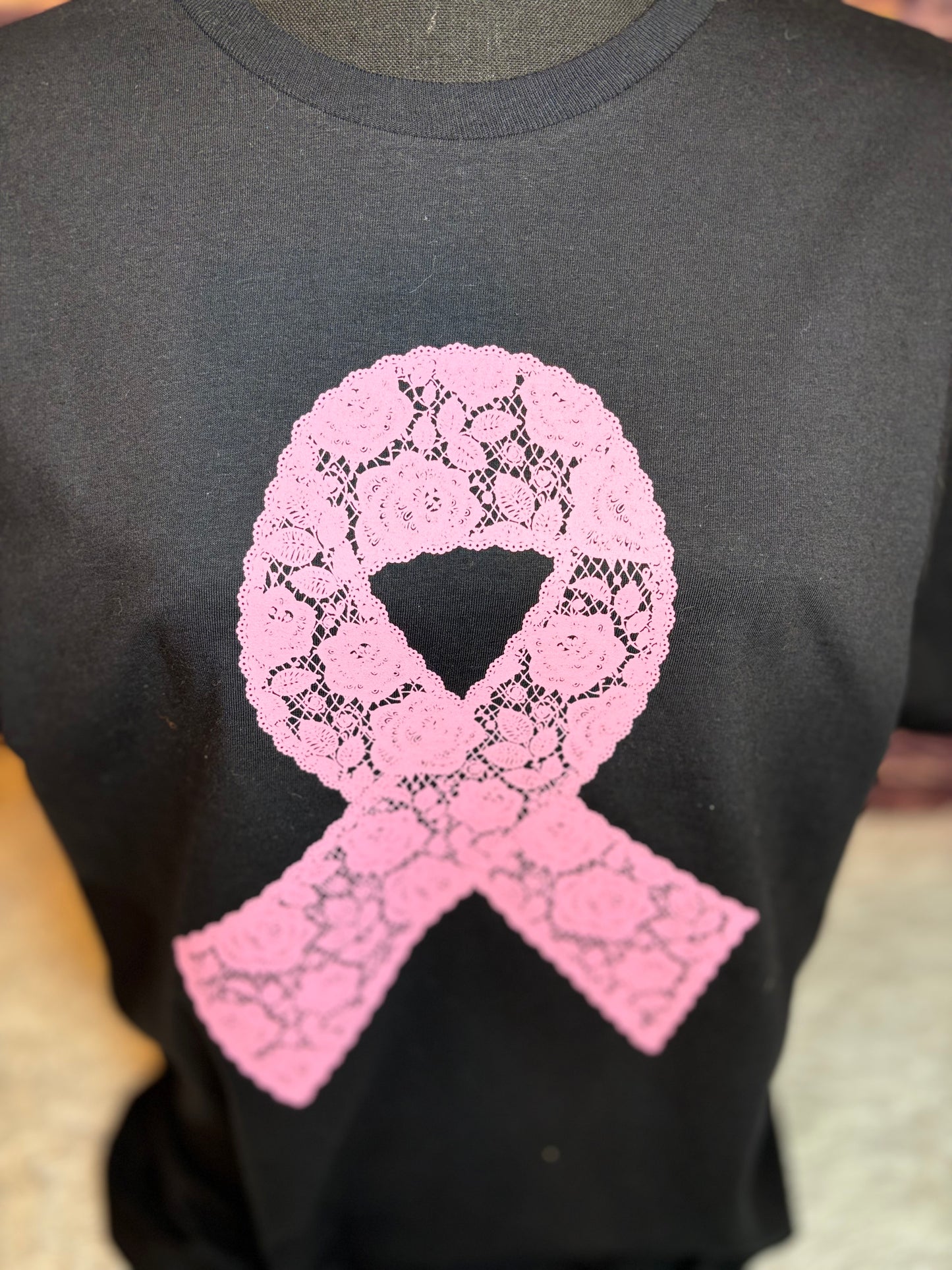 Black heat pressed t-shirt with a pink lace floral ribbon design- breast cancer awareness