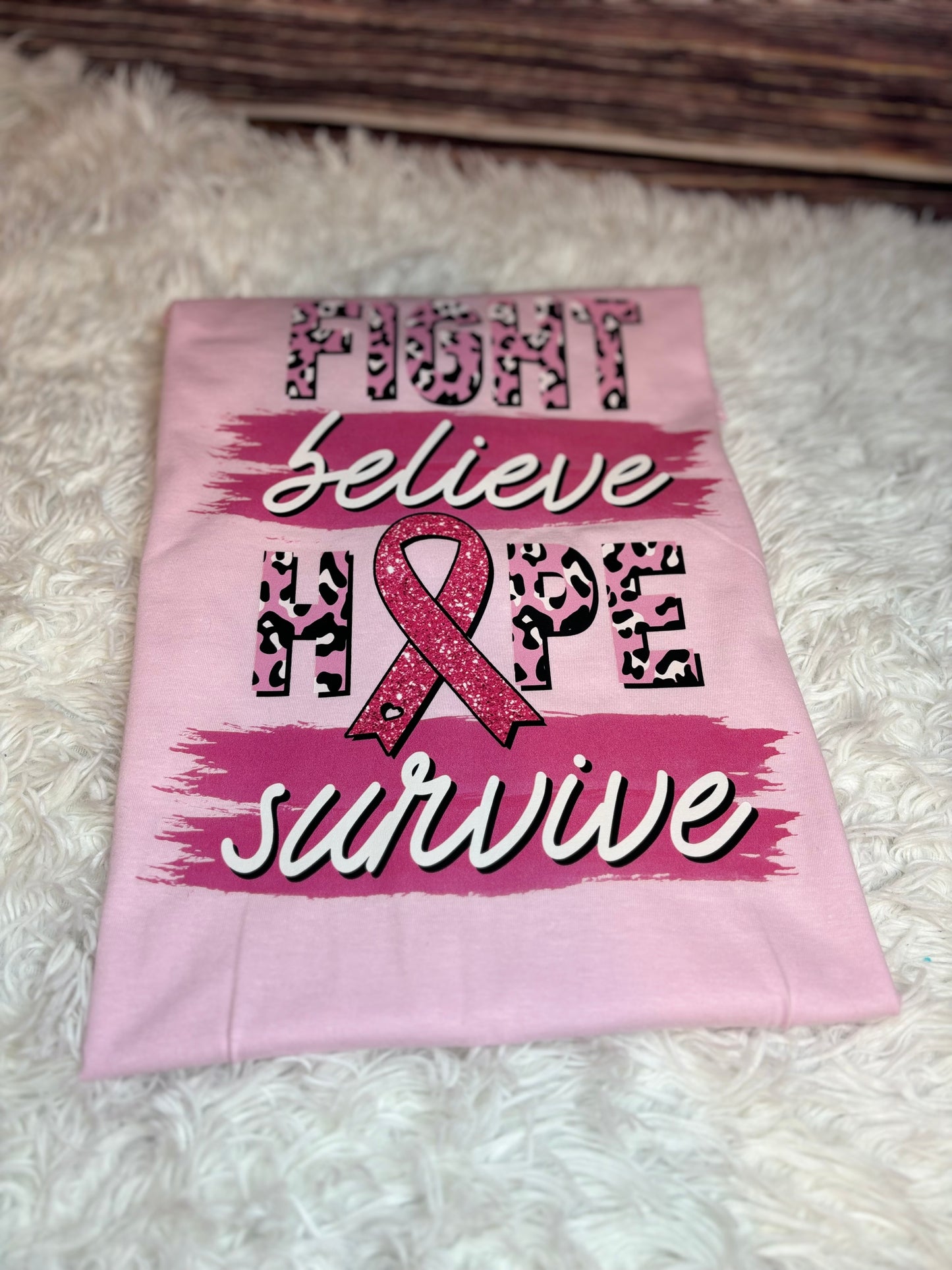 Light pink heat pressed t-shirt with "Fight, Believe, Hope, Survive." Breast Cancer Awareness t-shirt. Features leopard print