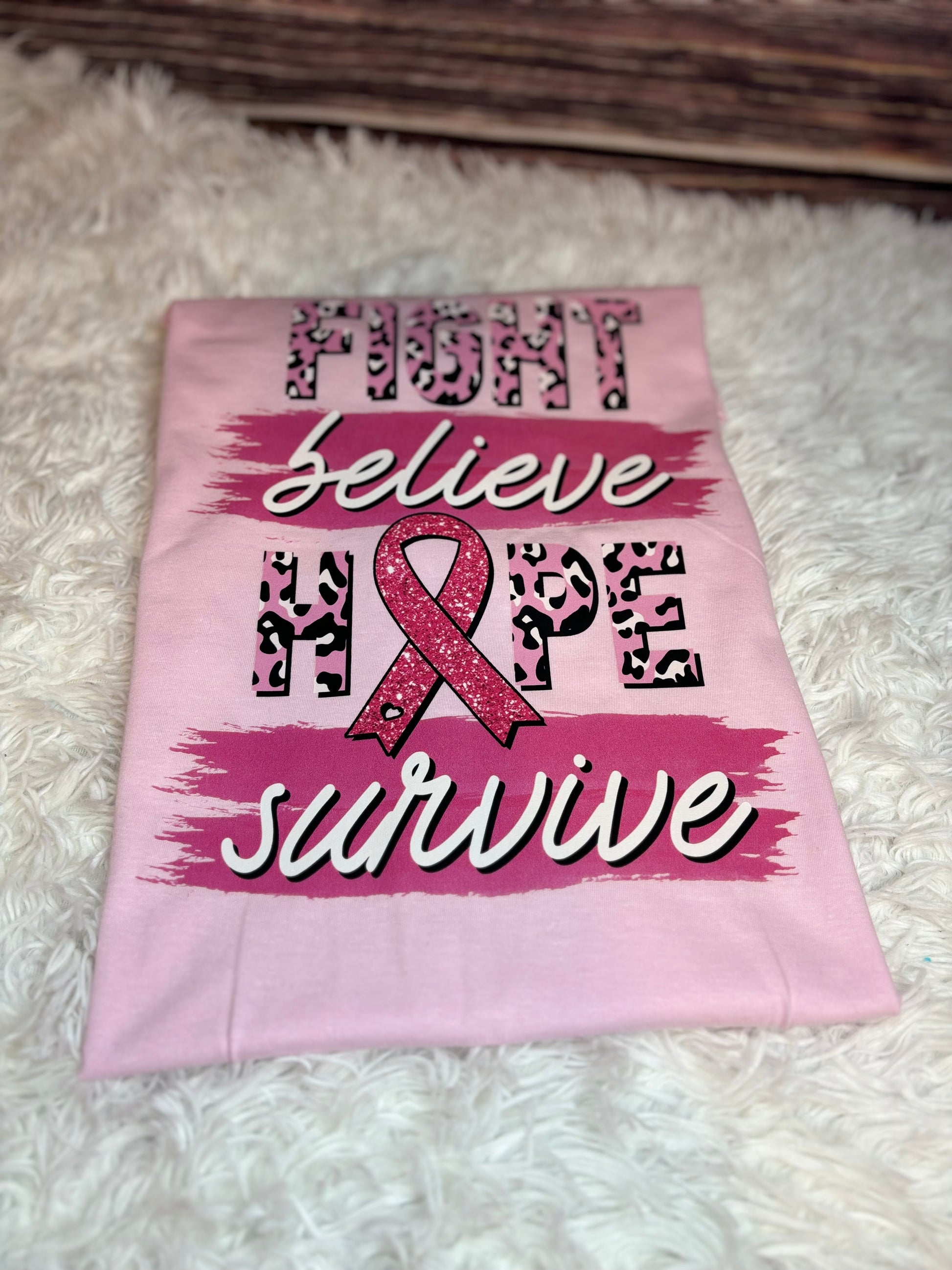 Light pink heat pressed t-shirt with "Fight, Believe, Hope, Survive." Breast Cancer Awareness t-shirt. Features leopard print