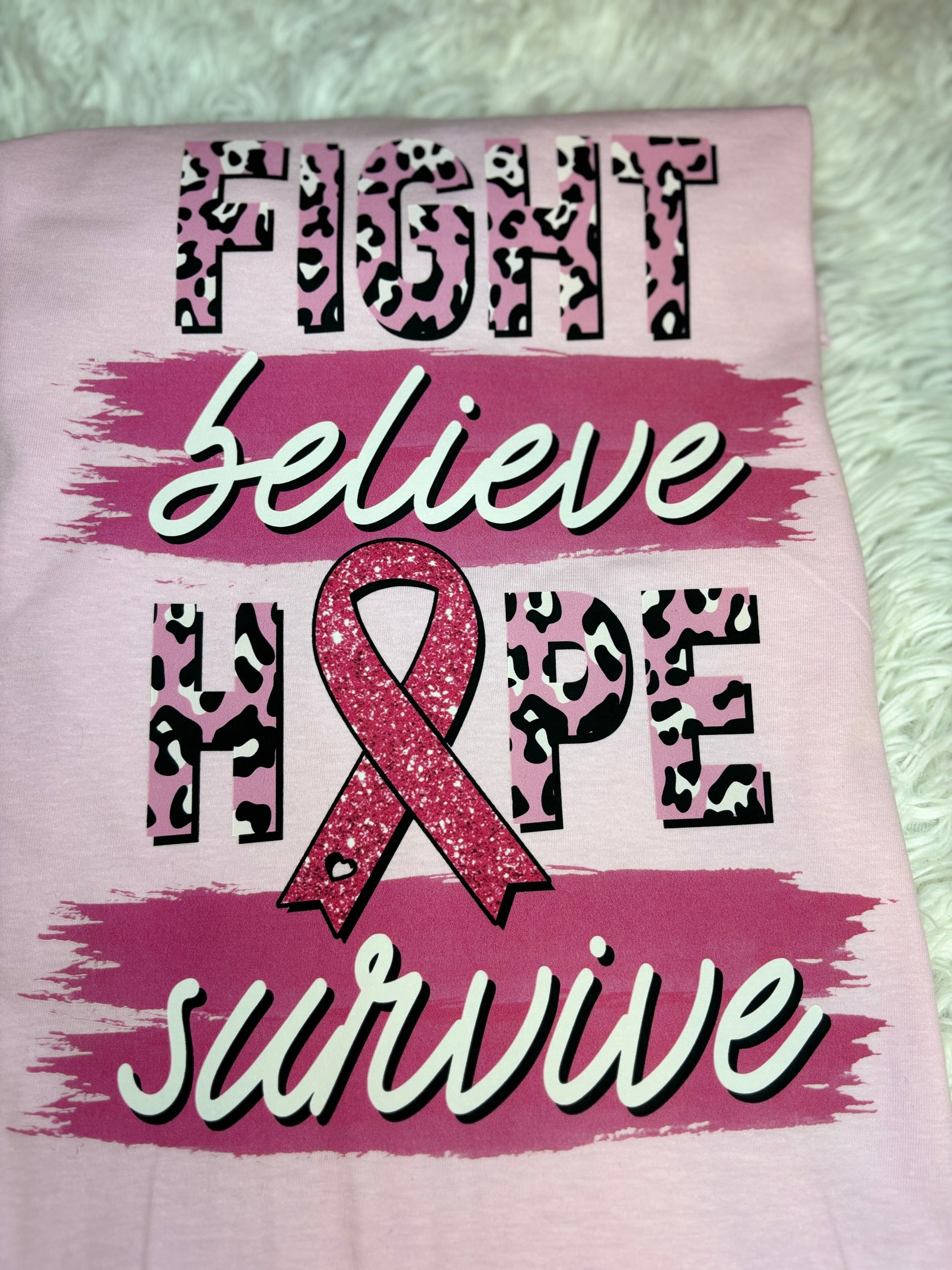 Light pink heat pressed t-shirt with "Fight, Believe, Hope, Survive." Breast Cancer Awareness t-shirt. Features leopard print