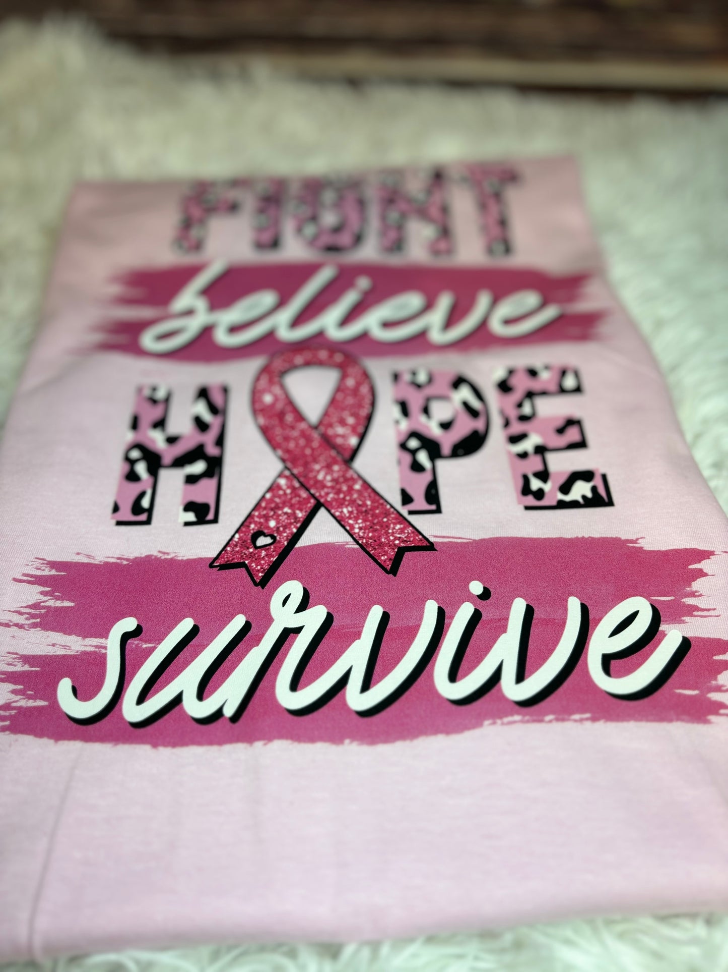 Light pink heat pressed t-shirt with "Fight, Believe, Hope, Survive." Breast Cancer Awareness t-shirt. Features leopard print